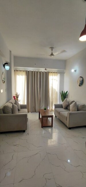 Living Room in Studio Apartment at Earthcon Casa Grande II, Chi V Greater Noida – for Rent