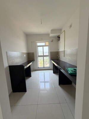 Kitchen in 2 BHK Apartment at Godrej Emerald Vista, Ghodbunder Road – for Rent