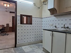 Kitchen in 4 BHK Builder Floor at Chirag Enclave – for Sale