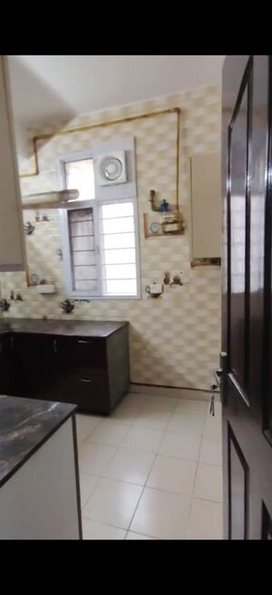 Kitchen in 2 BHK Apartment at Jaipuria Sunrise Greens, Ahinsa Khand 1 – for Sale