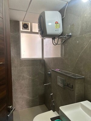 Bathroom in 3 BHK Apartment at Artique Uptown Skylla, International Airport Road – for Rent