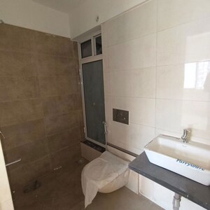 Bathroom in 1 BHK Apartment at Omkar Signet, Malad East – for Rent