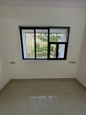 Room in 2 BHK Apartment at Dheeraj Godavari Apartment, Malad West – for Rent