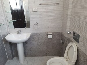 Bathroom in 4 BHK Apartment at Pushpanjali Orchid Park, Rajpur – for Rent
