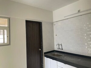 Kitchen in 1.5 BHK Apartment at Sankla Satyam Niranjani, Hadapsar – for Rent