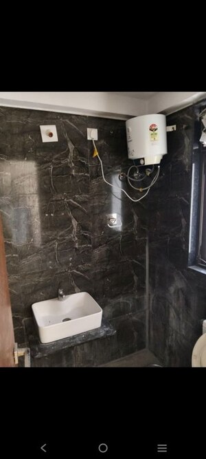 Bathroom in 3 BHK Apartment at Ganesh Malabar County, Near Nirma University On Sg Highway – for Rent