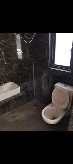 Bathroom in 3 BHK Apartment at Ganesh Malabar County, Near Nirma University On Sg Highway – for Rent