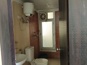 Bathroom in 2 BHK Apartment at Mahagun My Woods, Sector 16c Greater Noida – for Rent