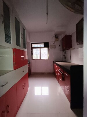 Kitchen in 2.5 BHK Apartment at Runwal Garden City, Balkum Pada – for Rent