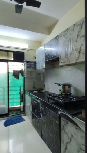 Kitchen in 1 BHK Apartment at RNA NG Canary, Mira Road – for Sale
