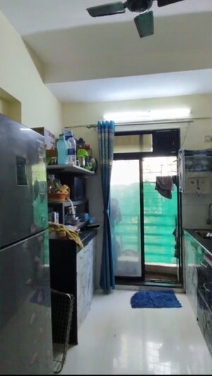 Kitchen in 1 BHK Apartment at RNA NG Canary, Mira Road – for Sale