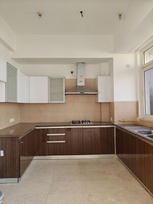 Kitchen in 3 BHK Apartment at Puri Diplomatic Greens Phase I, Sector 111 – for Rent