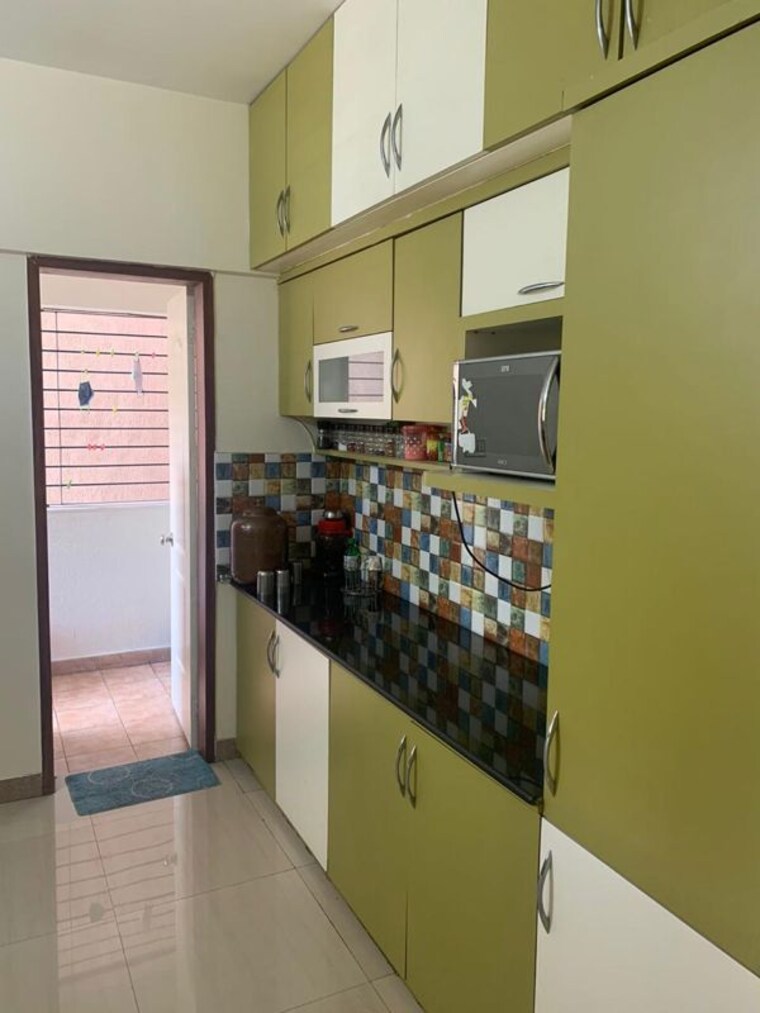 Kitchen, magarpatta-jasminium 3 Bedroom 1500 Sq.Ft. Apartment In Hadapsar Pune 10346489