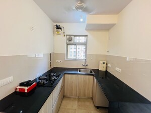 Kitchen in 1 BHK Apartment at Hiranandani The Walk, Ghodbunder Road – for Rent