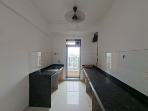 Kitchen in 2 BHK Apartment at Rustomjee Urbania Aurelia, Thane West – for Rent