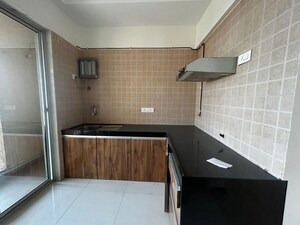 Kitchen in 1 BHK Apartment at Raunak Unnathi Woods, Ghodbunder Road – for Rent