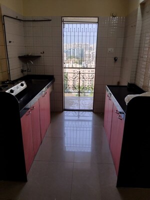 Kitchen in 2 BHK Apartment at Yari Road – for Rent