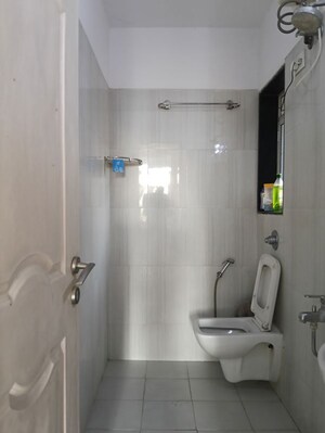 Bathroom in 2 BHK Apartment at Puranik City, Kasarvadavali – for Rent