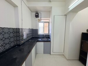 Kitchen in 1 BHK Apartment at Puranik City, Kasarvadavali – for Rent