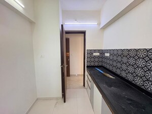 Kitchen in 1 BHK Apartment at Puranik Aarambh, Ghodbunder Road – for Rent