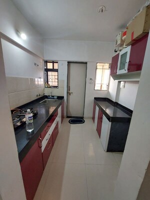 Kitchen in 1 BHK Apartment at DSK Meghmalhar Phase I, Sinhagad Road – for Sale
