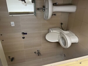 Bathroom in 2 BHK Apartment at JKG Palm Resort, Raj Nagar Extension – for Rent