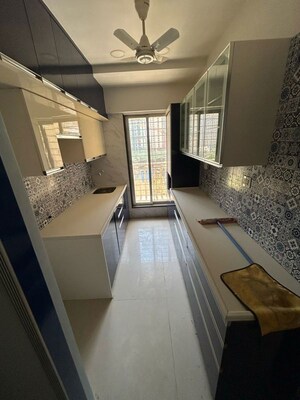 Kitchen in 2 BHK Apartment at Unique Poonam Estate Cluster 2, Mira Road – for Rent