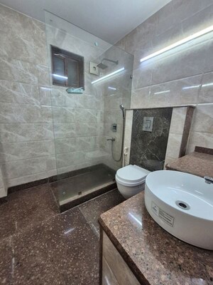 Bathroom in 4 BHK Builder Floor at Maharani Bagh – for Rent