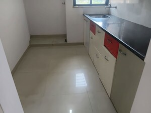 Kitchen in 1 BHK Apartment at Puranik Hometown, Ghodbunder Road – for Rent