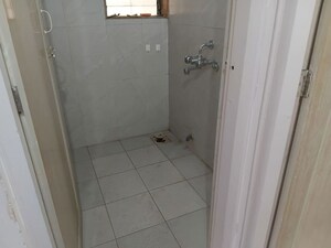 Bathroom in 1 BHK Apartment at Raunak Unnathi Woods, Ghodbunder Road – for Rent