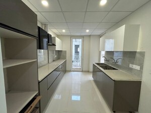 Kitchen in 3 BHK Apartment at Motia Blue Ridge, Dhakoli – for Sale