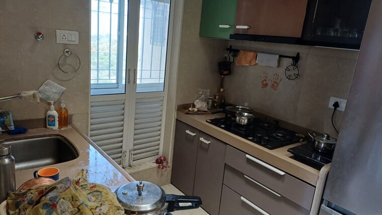 Kitchen, dosti-west-county 2 Bedroom 550 Sq.Ft. Apartment In Balkum Pada Thane 10353303