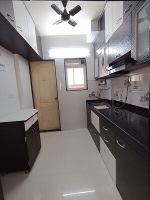 Kitchen in 1 BHK Apartment at Cosmos Orchid, Ghodbunder Road – for Rent