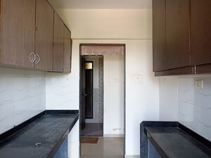 Kitchen in 2 BHK Apartment at Mukta Residency, Shilphata – for Rent