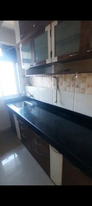 Kitchen in 1 BHK Apartment at Gala Lifestyle Pride Residency, Kasarvadavali – for Rent