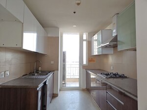 Kitchen in 3 BHK Apartment at Puri Diplomatic Greens Phase I, Sector 111 – for Rent