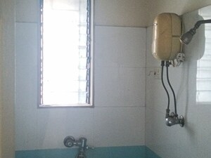 Bathroom in 1 BHK Apartment at Swastik Palms CHS, Brahmand – for Rent