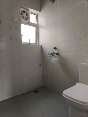 Bathroom in 3 BHK Apartment at Omaxe The Forest, Sector 92 – for Rent
