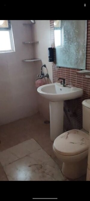 Bathroom in 3 BHK Apartment at Niho Saffron Scottish Garden, Ahinsa Khand 2 – for Sale