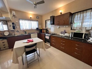 Kitchen in 4 BHK Independent House at Forest Trails Cascade And Crescent, Bhugaon – for Sale