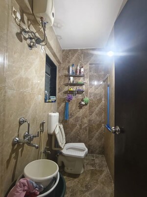 Bathroom in 1 BHK Apartment at Puranik City Reserva, Ghodbunder Road – for Rent