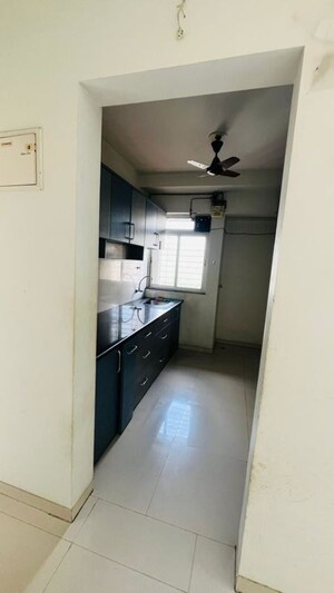 Kitchen in 1 BHK Apartment at Raunak Bliss B1, Ghodbunder Road – for Rent