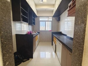 Kitchen in 2 BHK Apartment at Dhoot Sky Residency New Sonali CHSL, Malad West – for Rent