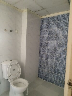 Bathroom in 2 BHK Apartment at Raj Nagar Extension – for Sale