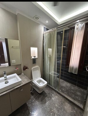 Bathroom in 3 BHK Builder Floor at Pamposh Enclave – for Sale