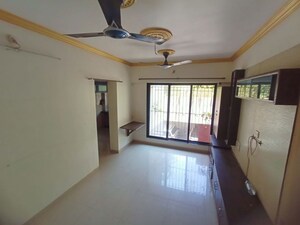 Living Room in 1 BHK Apartment at Raunak Unnathi Woods, Ghodbunder Road – for Rent