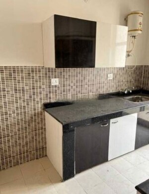 Kitchen in 2 BHK Apartment at Ansals Celebrity Greens, Sushant Golf City – for Rent
