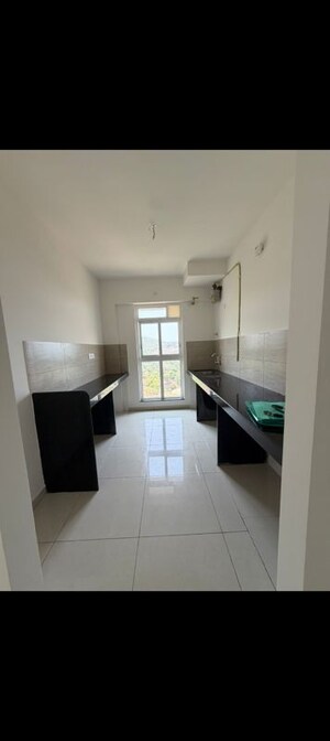 Kitchen in 2 BHK Apartment at Godrej Emerald, Ghodbunder Road – for Rent