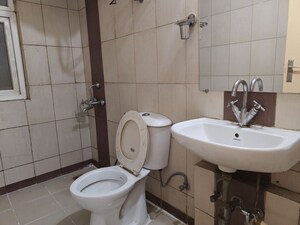 Bathroom in 2 BHK Apartment at Mahindra Aura, Sector 110a – for Rent
