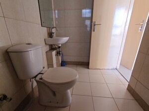 Bathroom in 3 BHK Apartment at Mahindra Aura, Sector 110a – for Rent